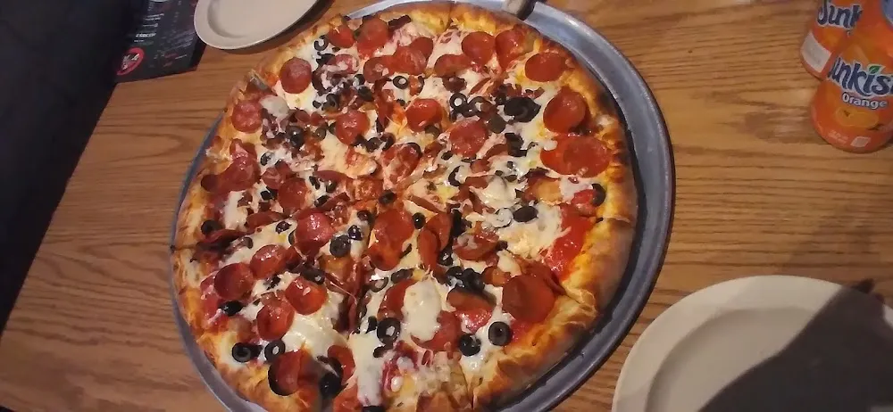 Pepperoni Bacon and Olive Pizza